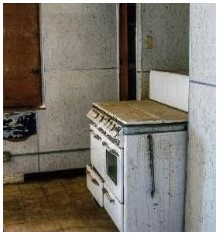 Before: view of vintage stove as it remained in the firehouse kitchen
